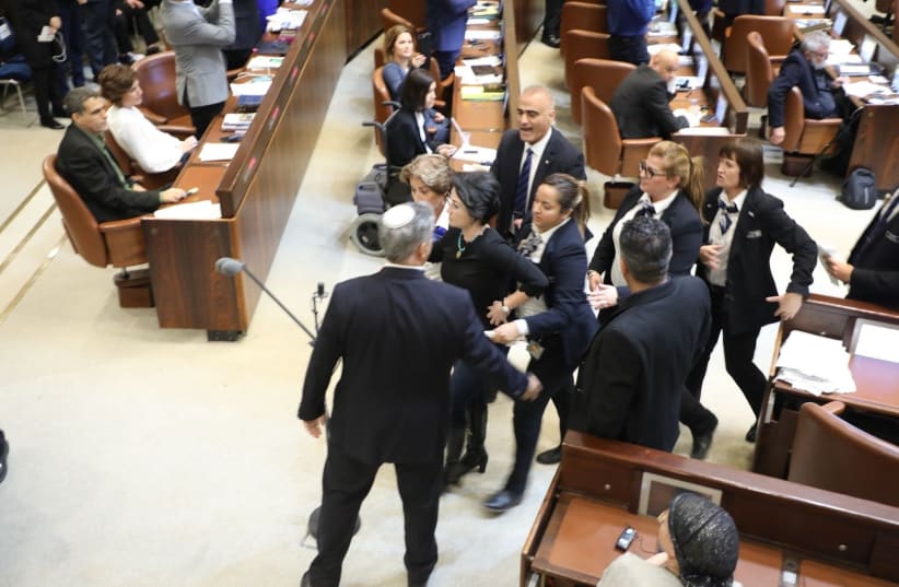MK Haneen Zoabi [Balad] removed from Knesset after protesting during speech by US Vice President Mike Pence  (photo credit: YITZHAK HARARI)
