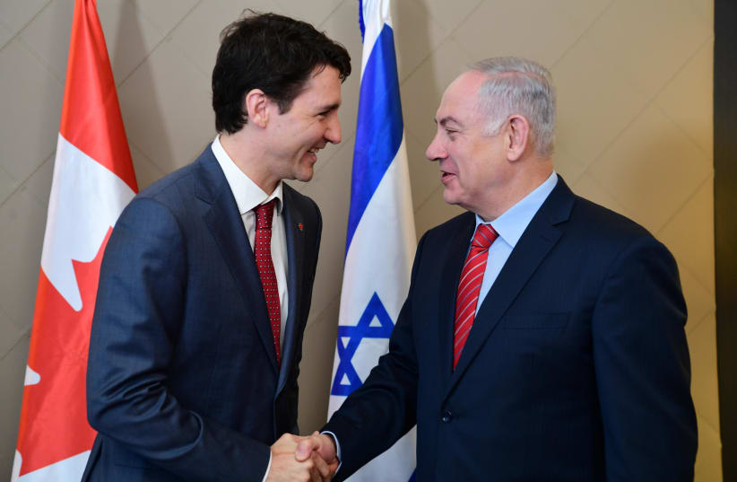 Canadian Prime Minister Justin Trudeau and Israeli Prime Minister Benjamin Netanyahu in Davos, Switzerland. (photo credit: AMOS BEN-GERSHOM/GPO)