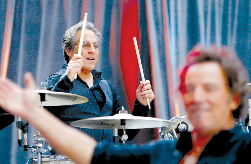 BRUCE SPRINGSTEEN performs with drummer Max Weinberg (top) of E Street Band during a concert at in New York in 2012 (photo credit: LUCAS JACKSON/REUTERS)