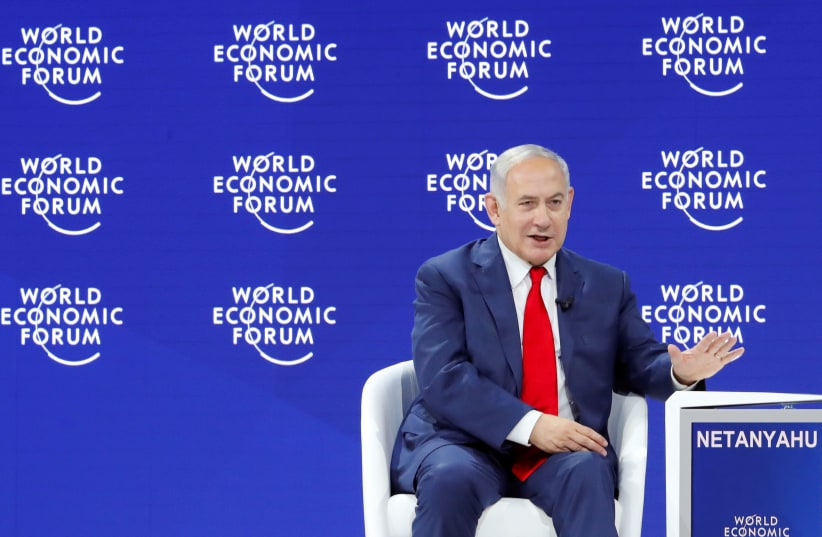 srael's Prime Minister Benjamin Netanyahu gestures as he speaks the World Economic Forum (WEF) annual meeting in Davos, Switzerland January 25, 2018 (photo credit: DENIS BALIBOUSE / REUTERS)
