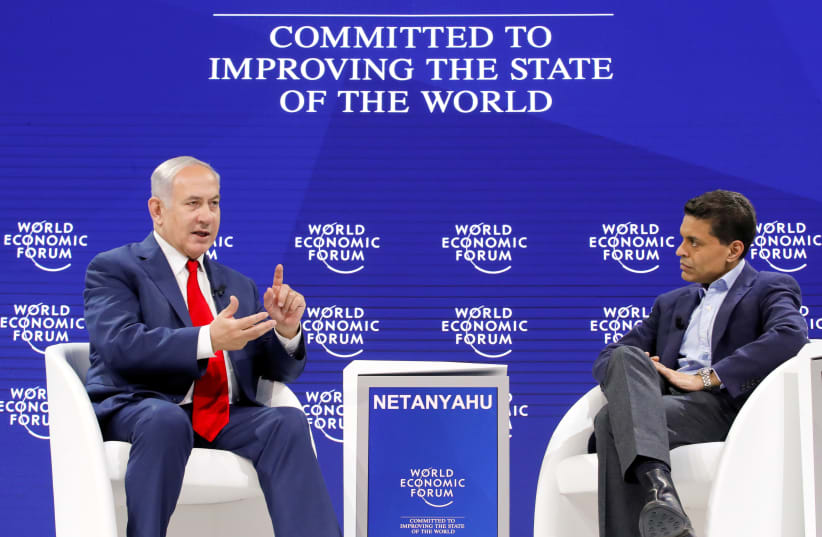 Israel's Prime Minister Benjamin Netanyahu speaks to the host Fareed Zakaria during the World Economic Forum (WEF) annual meeting in Davos, Switzerland January 25, 2018. (photo credit: REUTERS)