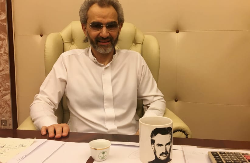 Saudi Arabian billionaire Prince Alwaleed bin Talal sits for an interview with Reuters in the office of the suite where he has been detained at the Ritz-Carlton in Riyadh, Saudi Arabia January 27, 2018 (photo credit: REUTERS)