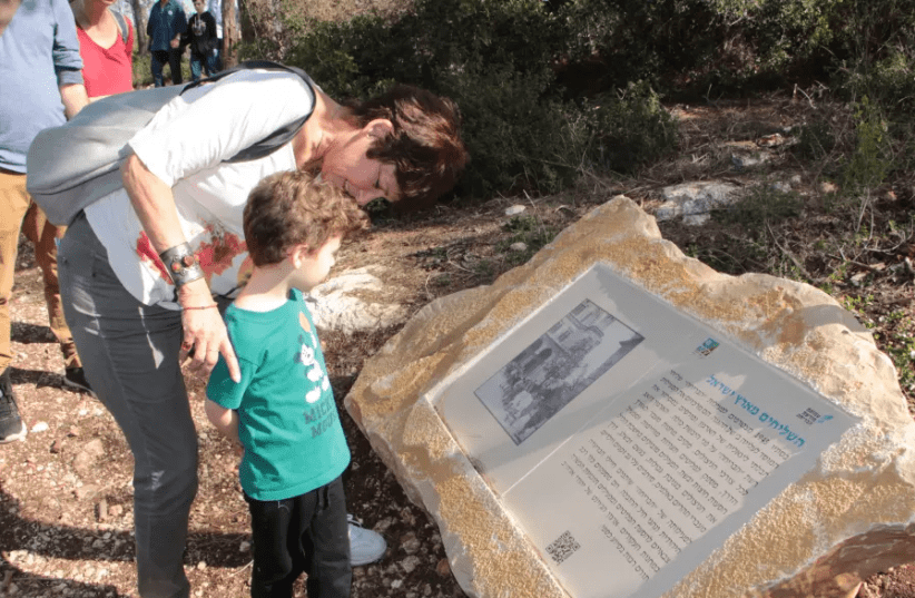A mother and son look at an information board on the Bricha Trail, a project that is being launched by JNF South Africa and KKL-JNF on Tu Bishvat on Wednesday. (photo credit: YOAV DEVIR KKL-JNF)