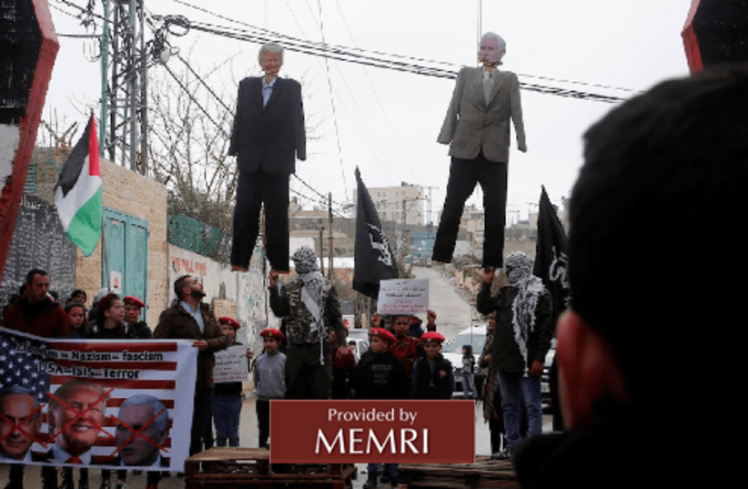 Palestinians hang effigies of US President Donald Trump and US Vice Presdient Mike Pence on January 27, 2018. (photo credit: MEMRI)