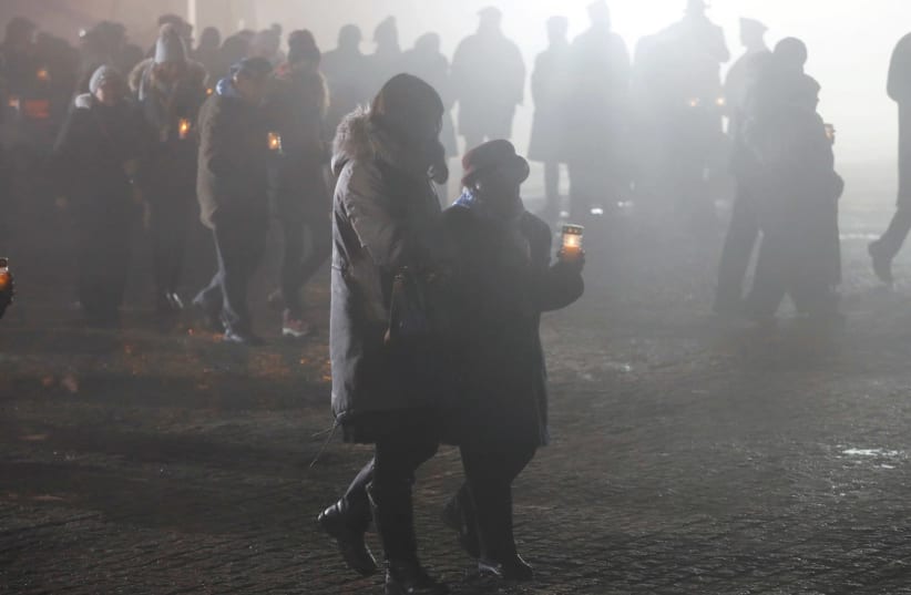 SURVIVORS AND guests light candles at the former Nazi concentration and extermination camp Auschwitz II-Birkenau in Poland last Saturday, on International Holocaust Remembrance Day. (photo credit: KACPER PEMPEL/REUTERS)