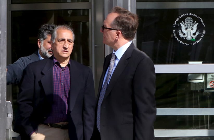 Ahmad Sheikhzadeh (C), a consultant to the Iranian mission to the United Nation, leaves Brooklyn Federal Court in New York. (photo credit: REUTERS)