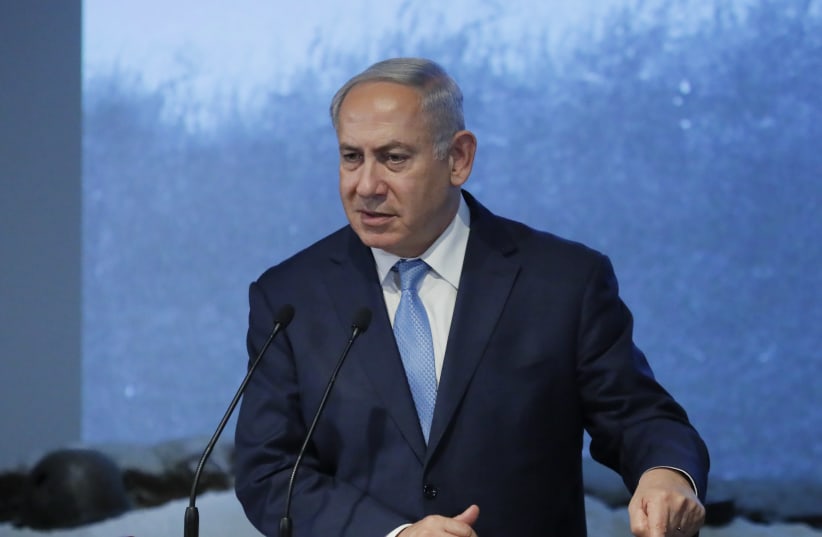 Benjamin Netanyahu delivers a speech during an event marking International Holocaust Remembrance Day at the Jewish Museum and Tolerance Centre in Moscow, Russia January 29, 2018.  (photo credit: REUTERS/MAXIM SHEMETOV)