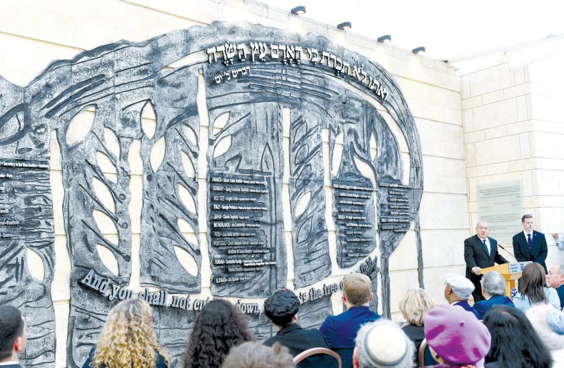 The memorial wall in dedication to the 36 diplomats who risked their lives to save Jews during the Holocaust. (photo credit: HAIM ZACH/GPO)