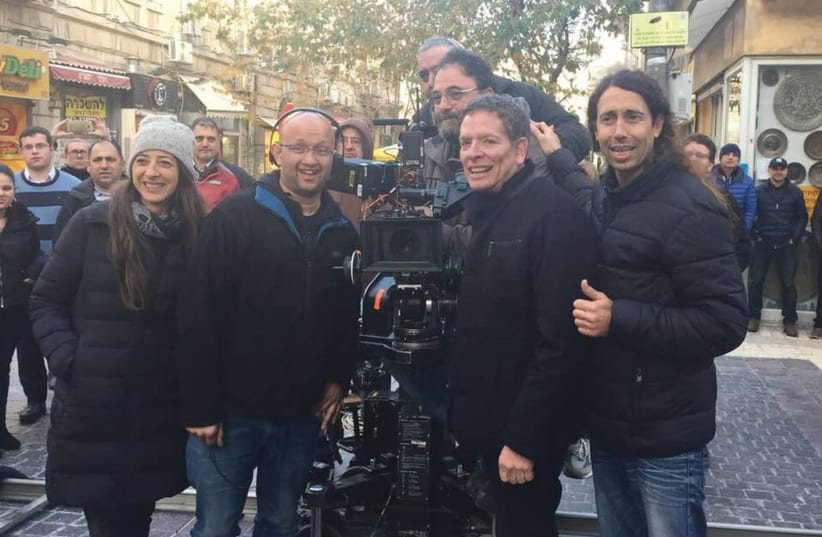 Writer/ Director David Zucker on the set of new Israeli comedy ‘Mossad’ on Jerusalem’s Ben-Yehuda Street, with the film’s director Alon Gur Arye (photo credit: Courtesy)