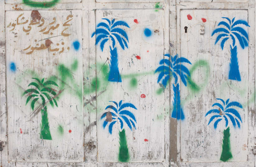 The palm tree is a Muslim symbol of fertility, and signifies the resident’s return from Mecca (photo credit: ASSAF EVRON)