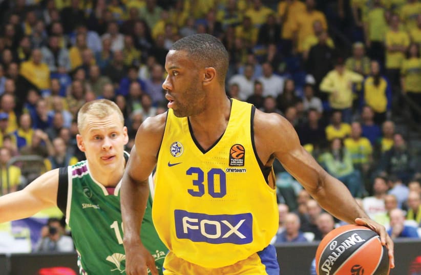Maccabi Tel Aviv guard Norris Cole (30) is looking to bounce back from his disappointing display in last week’s loss to Zalgiris Kaunas when the yellow-and-blue hosts Barcelona tonight in Euroleague action. (photo credit: ADI AVISHAI)
