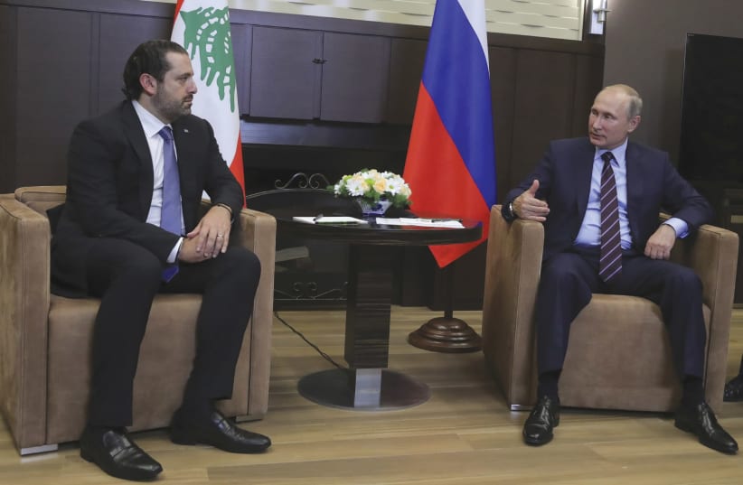 RUSSIAN PRESIDENT Vladimir Putin meets with Lebanese Prime Minister Hariri in Sochi in 2017. (photo credit: REUTERS)