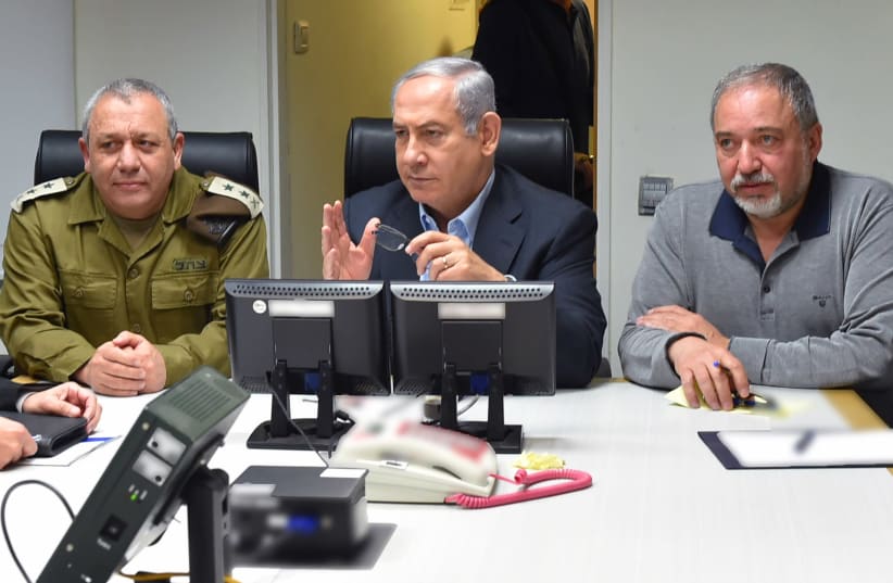 IDF Chief of Staff Gadi Eisenkot, Prime Minister Benjamin Netanyahu and Defense Minister Avigdor Liberman meet to discuss Israeli-Iranian escalation in Syria, February 2018 (photo credit: ARIEL HERMONI / DEFENSE MINISTRY)