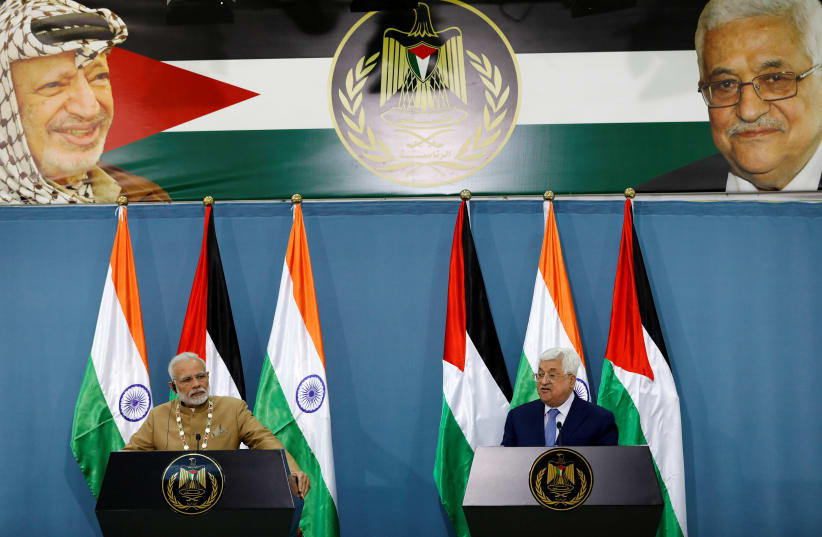 Palestinian President Mahmoud Abbas speaks during an news conference with India's Prime Minister Narendra Modi, in Ramallah (photo credit: REUTERS/MOHAMAD TOROKMAN)