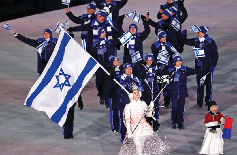  Israeli delegation to the Winter Olympics in Pyeongchang, South Korea, marches in during Friday’s Opening Ceremony  (photo credit: REUTERS)