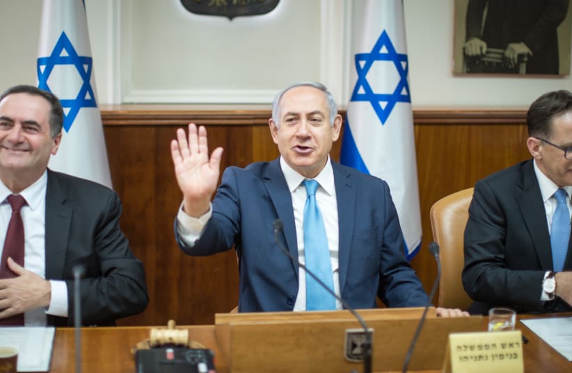Benjamin Netanyahu at the cabinet meeting, Febuary 11, 2018. (photo credit: EMIL SALMAN/POOL)