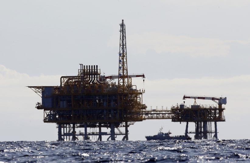 An offshore natural gas rig in the Mediterranean Sea (photo credit: GUSTAV NACARINO / REUTERS)