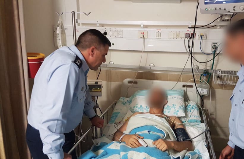 Maj. Gen. Amikam Norkin visits the wounded pilot on February 11th, 2018. (photo credit: IDF SPOKESPERSON'S OFFICE)