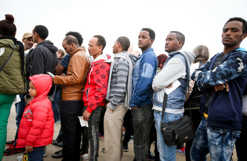 African asylum seekers line up to apply for a visa in Bnei Brak, Israel (photo credit: MARC ISRAEL SELLEM/THE JERUSALEM POST)