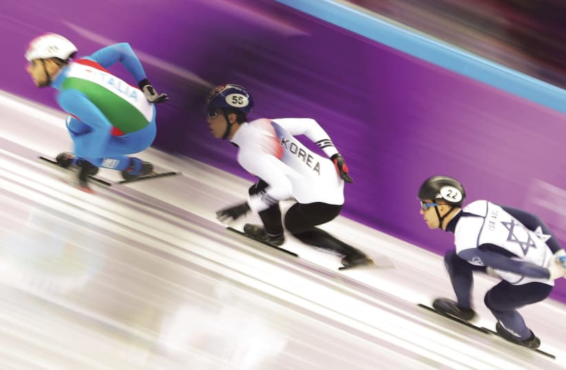 Israeli speedskater Vladislav Bynakov (right) competes in the men's 1,000 meters at the 2018 Pyeongchang Olympics (photo credit: REUTERS)