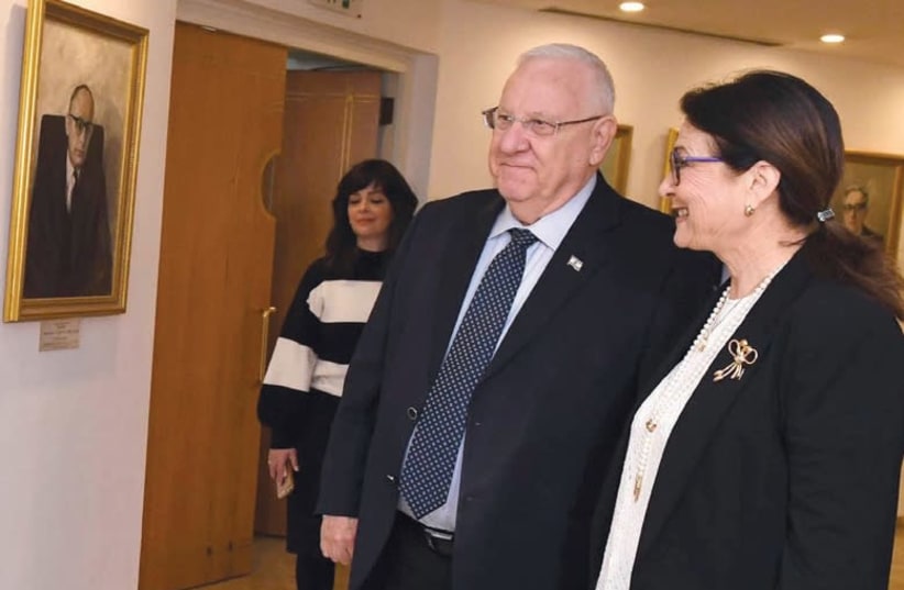 PRESIDENT REUVEN RIVLIN in the portrait gallery of the Supreme Court with Supreme Court President Esther Hayut (photo credit: MARK NEYMAN / GPO)