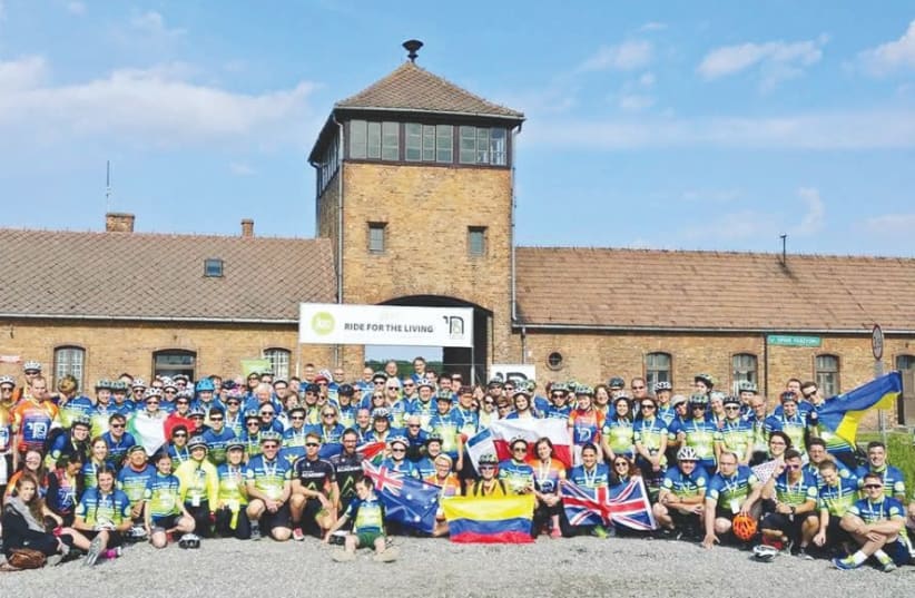 PEOPLE FROM across the globe take part in the JCC Krakow Ride for the Living in June 2017. The 88-km. ride starts at Auschwitz and ends in Krakow (photo credit: DAVID RUZHYNSKYI/FACEBOOK)