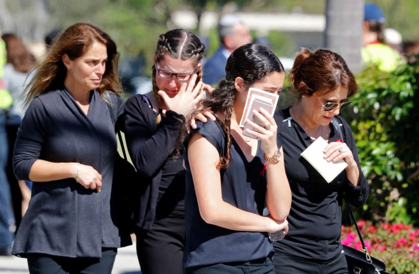 Mourners leave the funeral for Alyssa Alhadeff, 14, one of the victims of the school shooting, in North Fort Lauderdale, Florida, U.S., February 16, 2018 (photo credit: JOE SKIPPER/REUTERS)