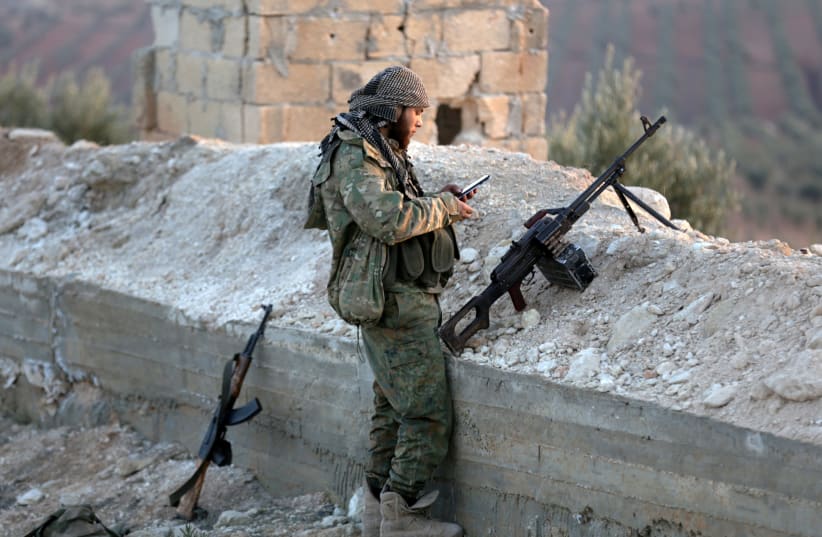 A Turkish-backed Free Syrian Army fighter in Afrin, Syria (photo credit: KHALIL ASHAWI / REUTERS)