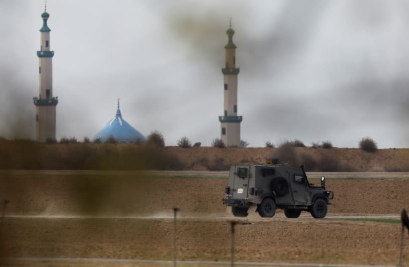 An Israeli military jeep drives near Israel's border with the Gaza Strip December 10, 2017. (photo credit: REUTERS/AMIR COHEN)