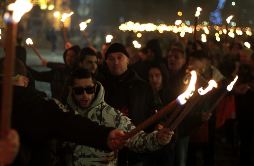 Members and supporters of several nationalist organizations take part in a march in commemoration of Bulgarian General Hristo Lukov in Sofia, Bulgaria, February 17, 2018 (photo credit: REUTERS/DIMITAR KYOSEMARLIEV)