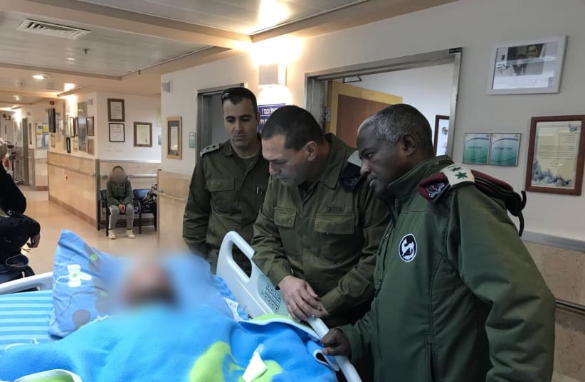 Southern Command Maj.-Gen. Eyal Zamir with one of the soldiers wounded on February 17, 2018 (photo credit: IDF SPOKESPERSON'S UNIT)