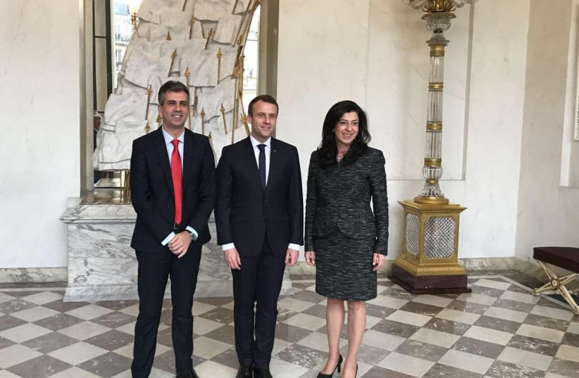 Economy Minister Eli Cohen (left) met with Palestinian counterpart Abeer Odeh (right) in Paris last week with French President Emmanuel Macron (center) to discuss steps to improve the Palestinian economy (photo credit: COURTESY ECONOMY MINISTRY)