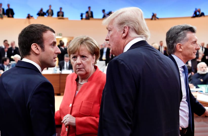 US President Donald Trump, German Chancellor Angela Merkel and French President Emmanuel Macron at the G-20 Summit in Hamburg, Germany, 2017 (photo credit: POOL)