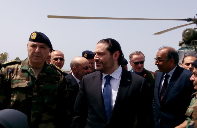 Lebanese Prime Minister Saad al-Hariri arrives with Army Commander General Joseph Aoun (L) at the United Nations Interim Force in Lebanon (UNIFIL) headquarters (photo credit: REUTERS/ALI HASHISHO)