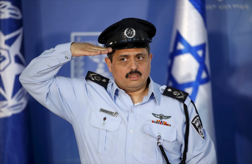 Police commissioner Roni Alsheich salutes during a ceremony (photo credit: BAZ RATNER/REUTERS)