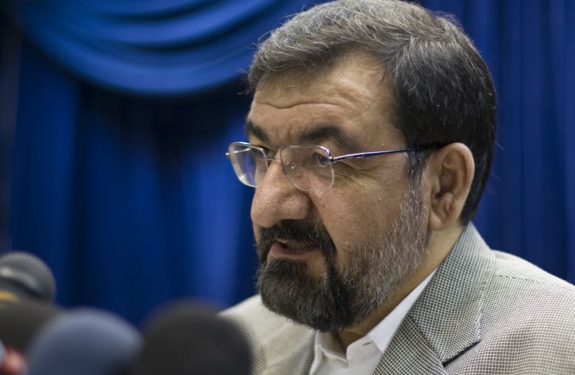 Iranian secretary of the Expediency Council arbitration body Mohsen Rezaei speaks during a news conference in Tehran (photo credit: REUTERS/RAHEB HOMAVANDI)
