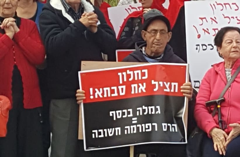 Protestors holding signs saying "Kahlon - Save Grandma!" " (photo credit: Courtesy)