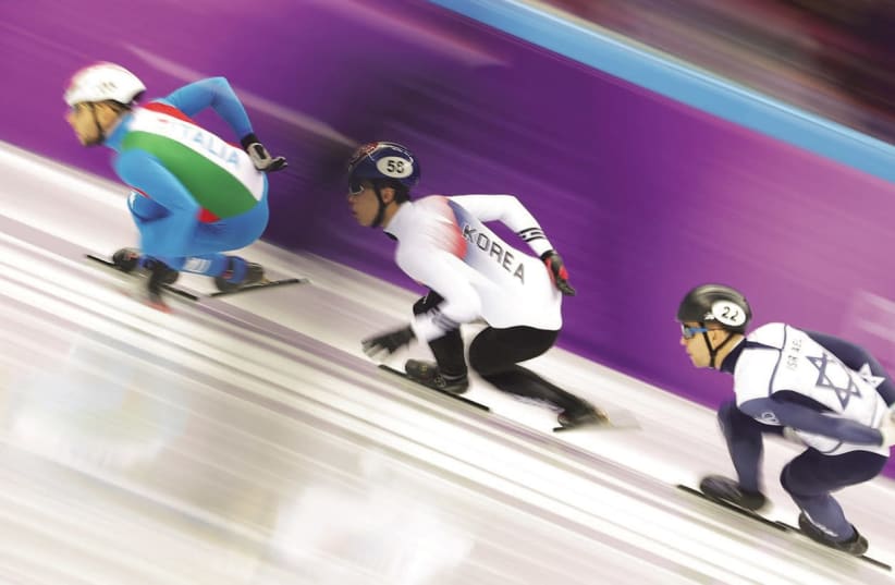 VLADISLAV BYKANOV (right) of Israel finished cleanly in his 500-meter heat in the short-track speedskating event at the Winter Olympics in Pyeongchang, albeit in last place with a time of 47.177 seconds (photo credit: REUTERS)