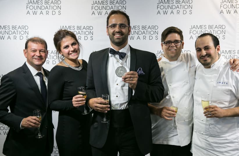 Alon Shaya (center) celebrates his win at the James Beard Awards ceremony in Chicago in 2016 (photo credit: GALDONES PHOTOGRAPHY/JAMES BEARD FOUNDATION)