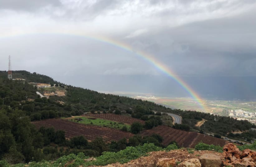 A RAINBOW stretches over Kibbutz Misgav Am in the Upper Galilee (photo credit: JOHN T. HUDDY/THE MEDIA LINE)