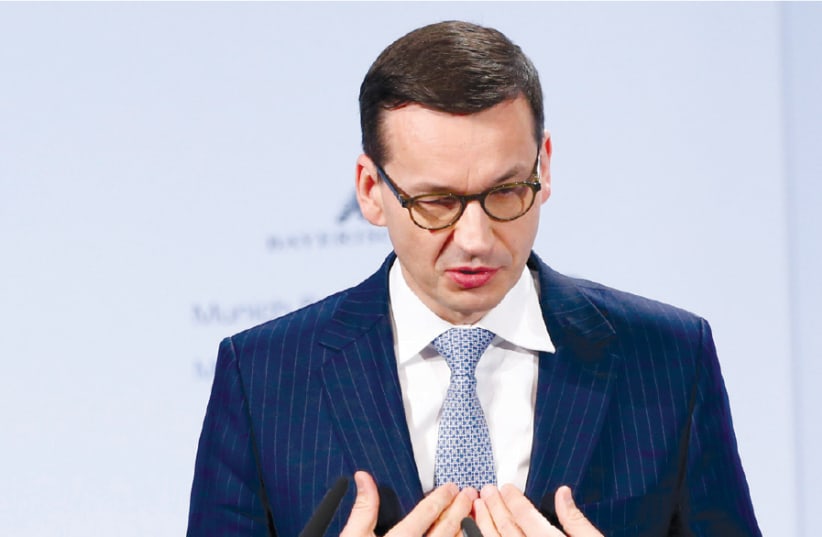 POLAND’S PRIME Minister Mateusz Morawiecki (photo credit: REUTERS/MICHAELA REHLE)