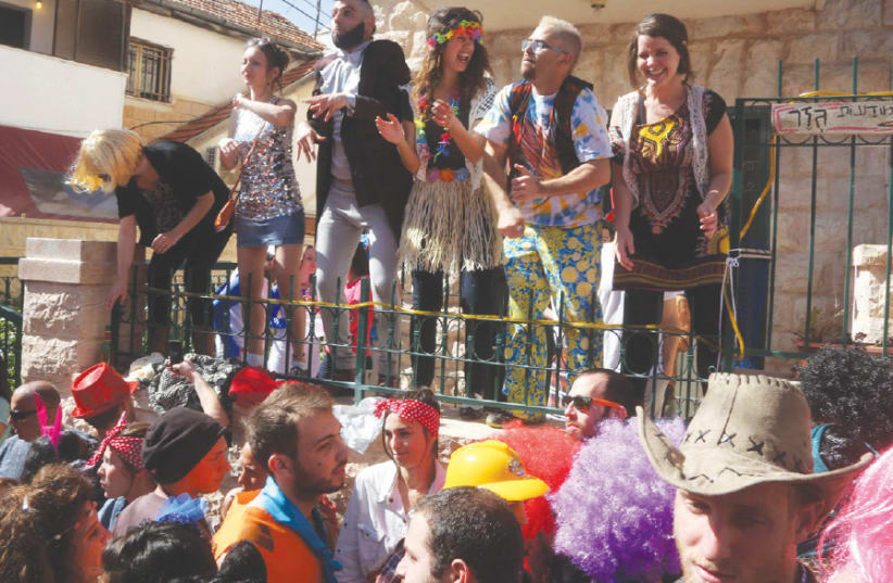 Purim revelers in the Nahlaot neighborhood (photo credit: MARC ISRAEL SELLEM)