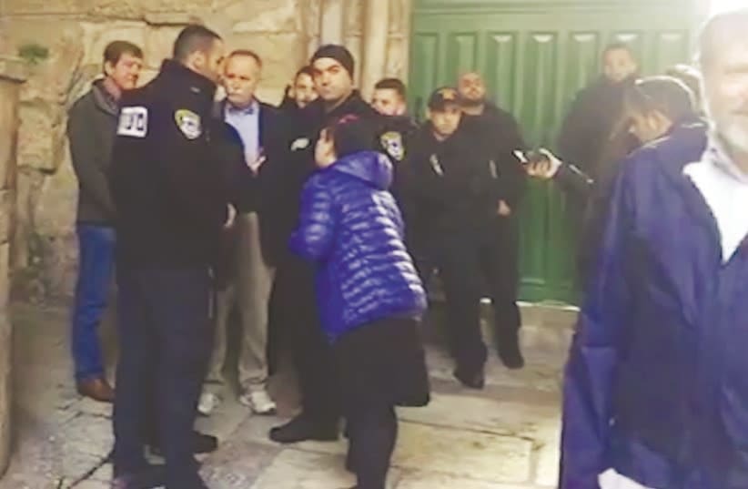 Police detain congressmen Scott Tipton (left) and David McKinley (3rd left) on the Temple Mount yesterday (photo credit: PROCLAIMING JUSTICE TO THE NATIONS)