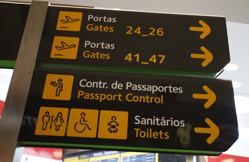Gates, passport control and toilets signs are seen at Lisbon's airport, Portugal June 24, 2016.  (photo credit: REUTERS)