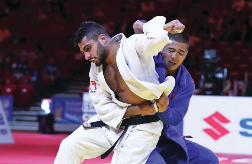 Israeli judoka Tohar Butbul (in white). (photo credit: INTERNATIONAL JUDO FEDERATION/COURTESY)
