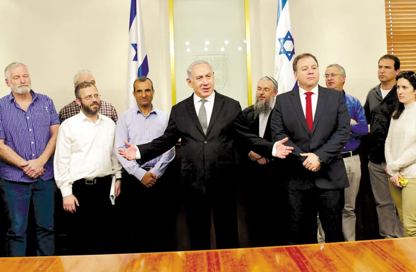 Prime Minister Benjamin Netanyahu meets with settler leaders after a cabinet vote legalizing the Netiv Ha'avot outpost, February 2018 (photo credit: AMOS BEN-GERSHOM/GPO)