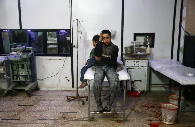 Wounded children in a hospital in the besieged town of Douma, Eastern Ghouta, Damascus, Syria (photo credit: REUTERS/BASSAM KHABIEH)