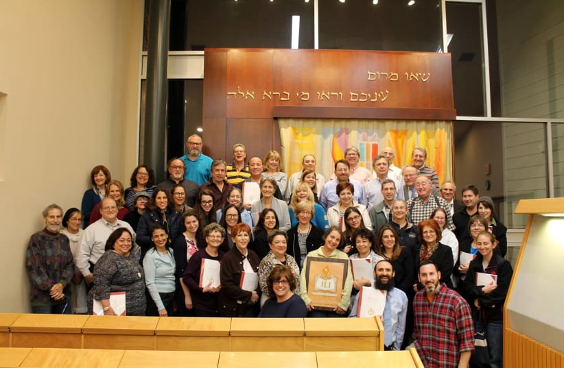 Professionals from a variety of Jewish backgrounds celebrate the completion of their Jewish Learning Institute course at Chabad of Potomac last year. (photo credit: JLI)