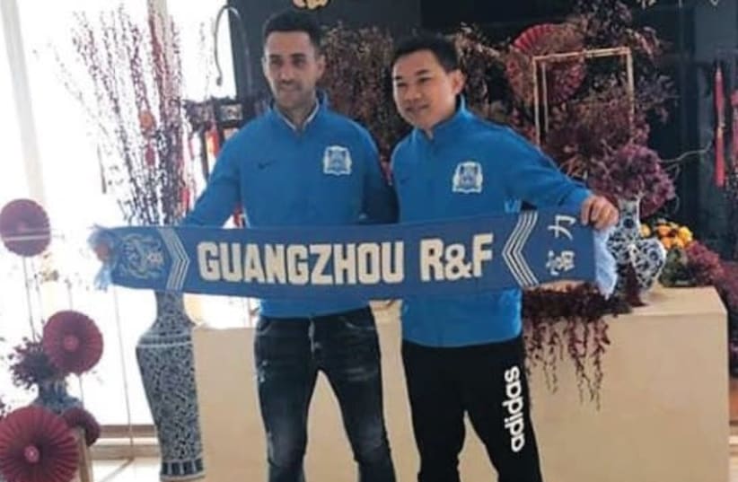 ISRAELI SOCCER STAR Eran Zahavi (left) poses with Guangzhou R&F chairman Zhang Li after inking a lucrative three-year contract extension with the Chinese club. (photo credit: INSTAGRAM)