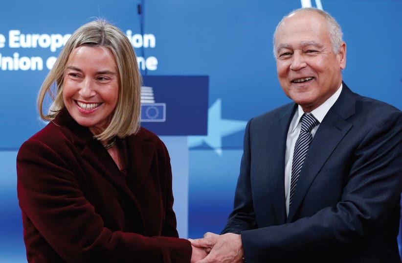 EUROPEAN UNION foreign-policy chief Federica Mogherini welcomes Arab League Secretary-General Ahmed Aboul Gheit ahead of a meeting to discuss the Middle East peace process on February 26th in Brussels. (photo credit: REUTERS/FRANCOIS LENOIR)